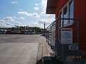 Dalitrans logistický areál, vrátnice,  rychlonabíječka Greenway je za ní stále rovně po pravé straně